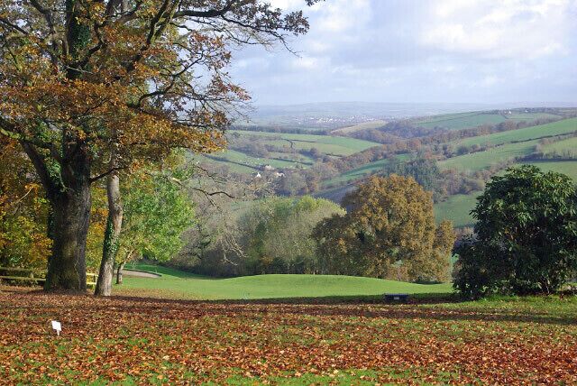 Highbullen Golf Course A carpet of fallen leaves covers Highbullen's golf course, except the greens and fairways which are kept immaculately clear. The Mole Valley lies beyond.