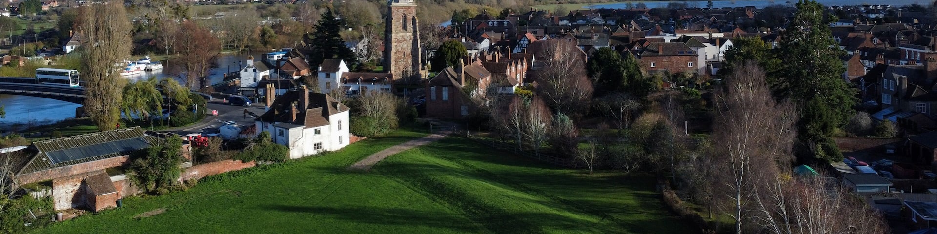 Aerial shot of church tower in a village