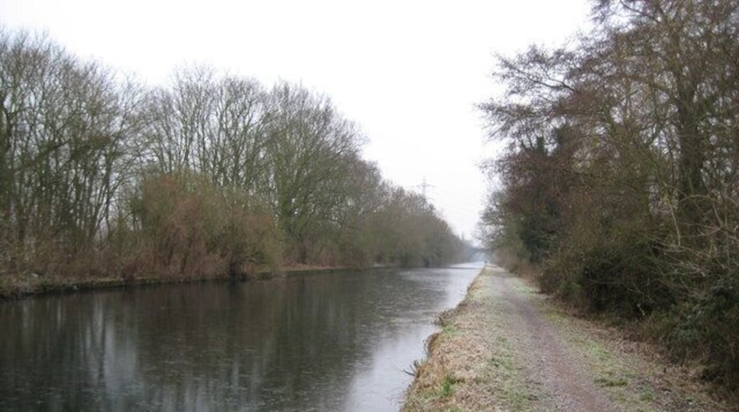 Grand Union Canal in South Harefield. The vast and deserted expanse of the Widewater reach of the Grand Union Canal, downstream of 1109992, can be seen here. Taken on the last day of 2008, the canal had a layer of ice, about 5 millimetres thick, on its surface. In the very distance is the railway viaduct seen at closer quarters in 1110066.