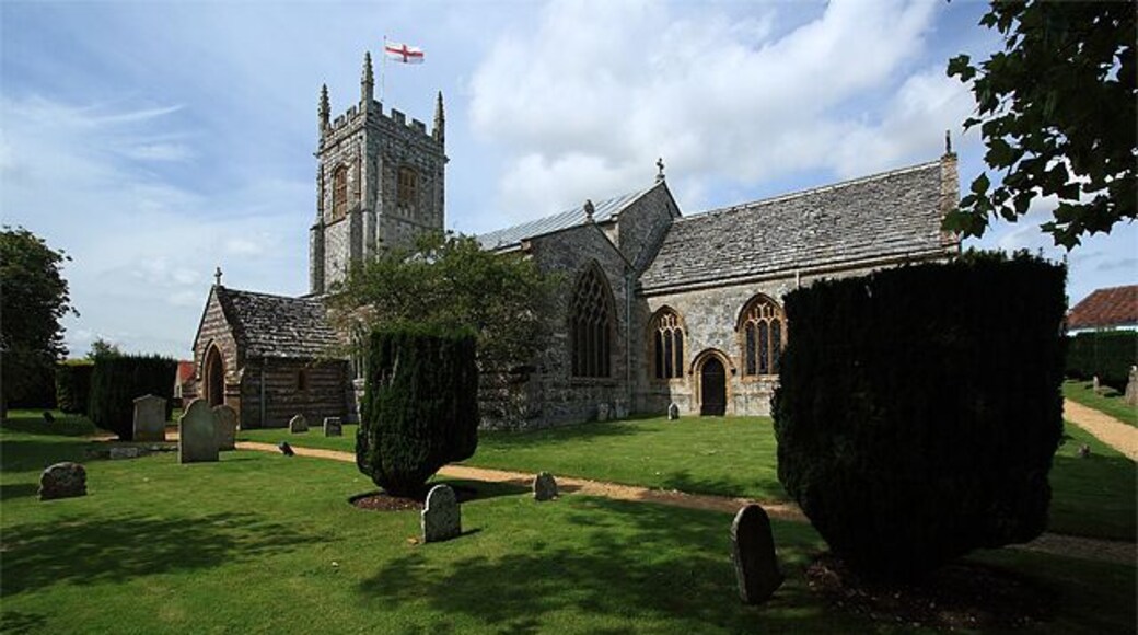 Parish Church of St John the Baptist - Bere Regis. It has Pre-Conquest origins, but was largely rebuilt in the C12, and further enlarged during the C13 - C16. It was restored c.1875 by G.E. Street. Justifiably famed for its mock hammer-beamed late C15 nave roof, with its braced tie beams incorporating figures of the apostles 924309.