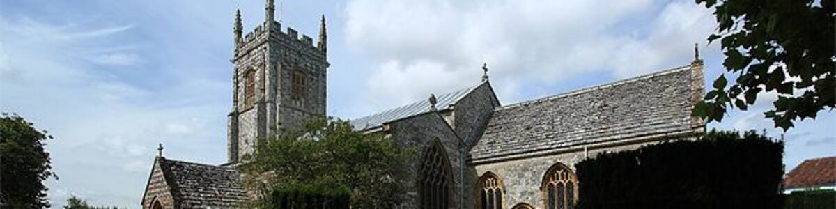 Parish Church of St John the Baptist - Bere Regis. It has Pre-Conquest origins, but was largely rebuilt in the C12, and further enlarged during the C13 - C16. It was restored c.1875 by G.E. Street. Justifiably famed for its mock hammer-beamed late C15 nave roof, with its braced tie beams incorporating figures of the apostles 924309.