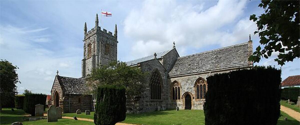 Parish Church of St John the Baptist - Bere Regis. It has Pre-Conquest origins, but was largely rebuilt in the C12, and further enlarged during the C13 - C16. It was restored c.1875 by G.E. Street. Justifiably famed for its mock hammer-beamed late C15 nave roof, with its braced tie beams incorporating figures of the apostles 924309.