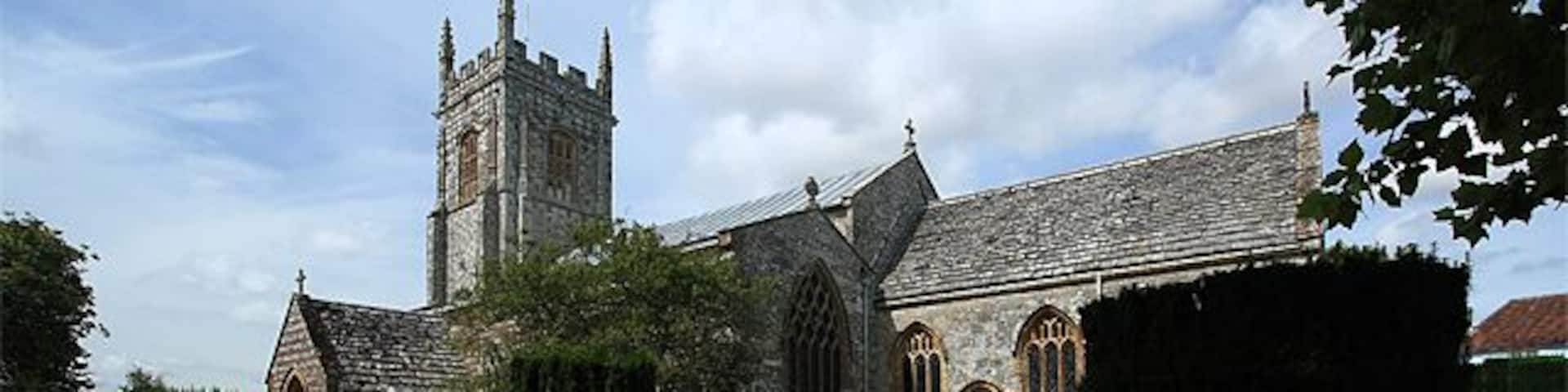 Parish Church of St John the Baptist - Bere Regis. It has Pre-Conquest origins, but was largely rebuilt in the C12, and further enlarged during the C13 - C16. It was restored c.1875 by G.E. Street. Justifiably famed for its mock hammer-beamed late C15 nave roof, with its braced tie beams incorporating figures of the apostles 924309.