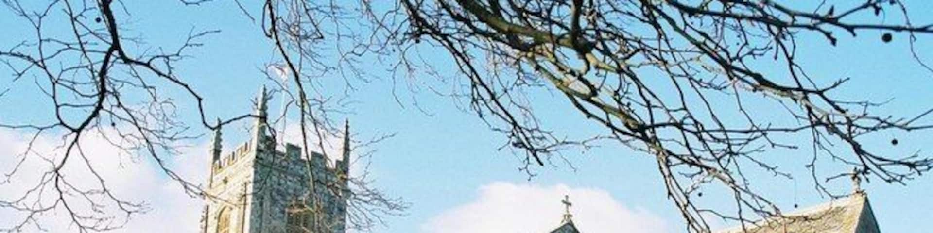 Bere Regis: parish church of St. John the Baptist A very pretty church on the outside, with its 16th-century flint and stone chequered tower. However, its most remarkable feature is the wooden roof, for which we must venture inside: 456583