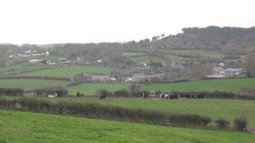 Bere Regis - Woodbury Hill To the right of photograph is Bere Regis First School. Green Close is just left of the school. Black Hill can be seen in the distance and is a designated Site of Special Scientific Interest.