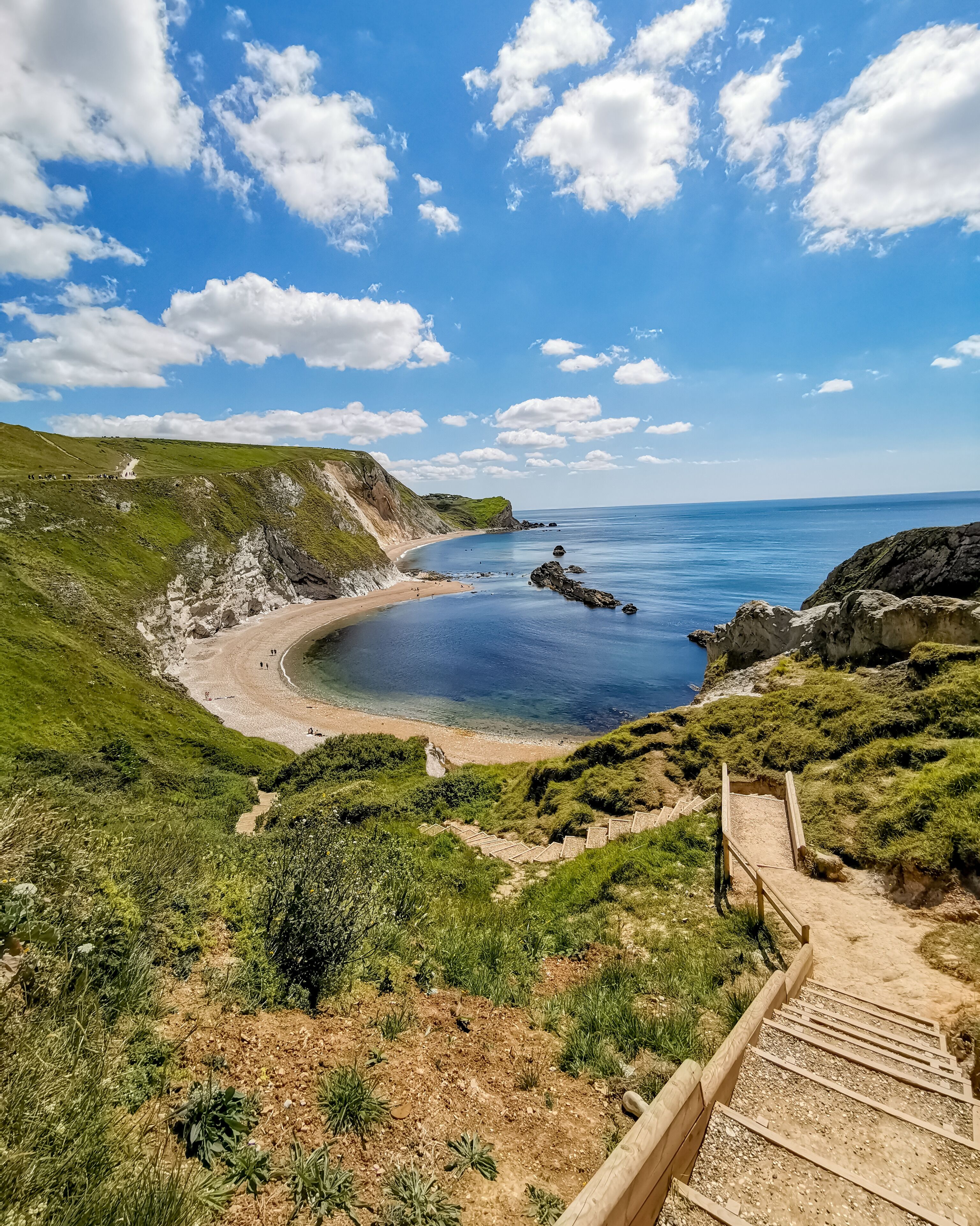 If you can face the dozens of steps down, this beach is a world away from the hustle of Durdle Door. Weird, considering its the next Cove along.  #lifeatexpedia #beaches #visitbritain