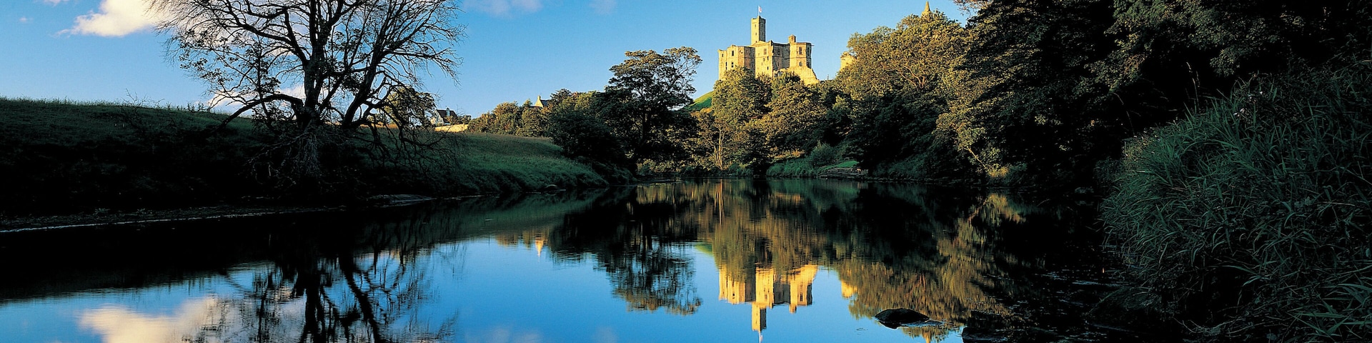 Castle overlooking reflective lake
