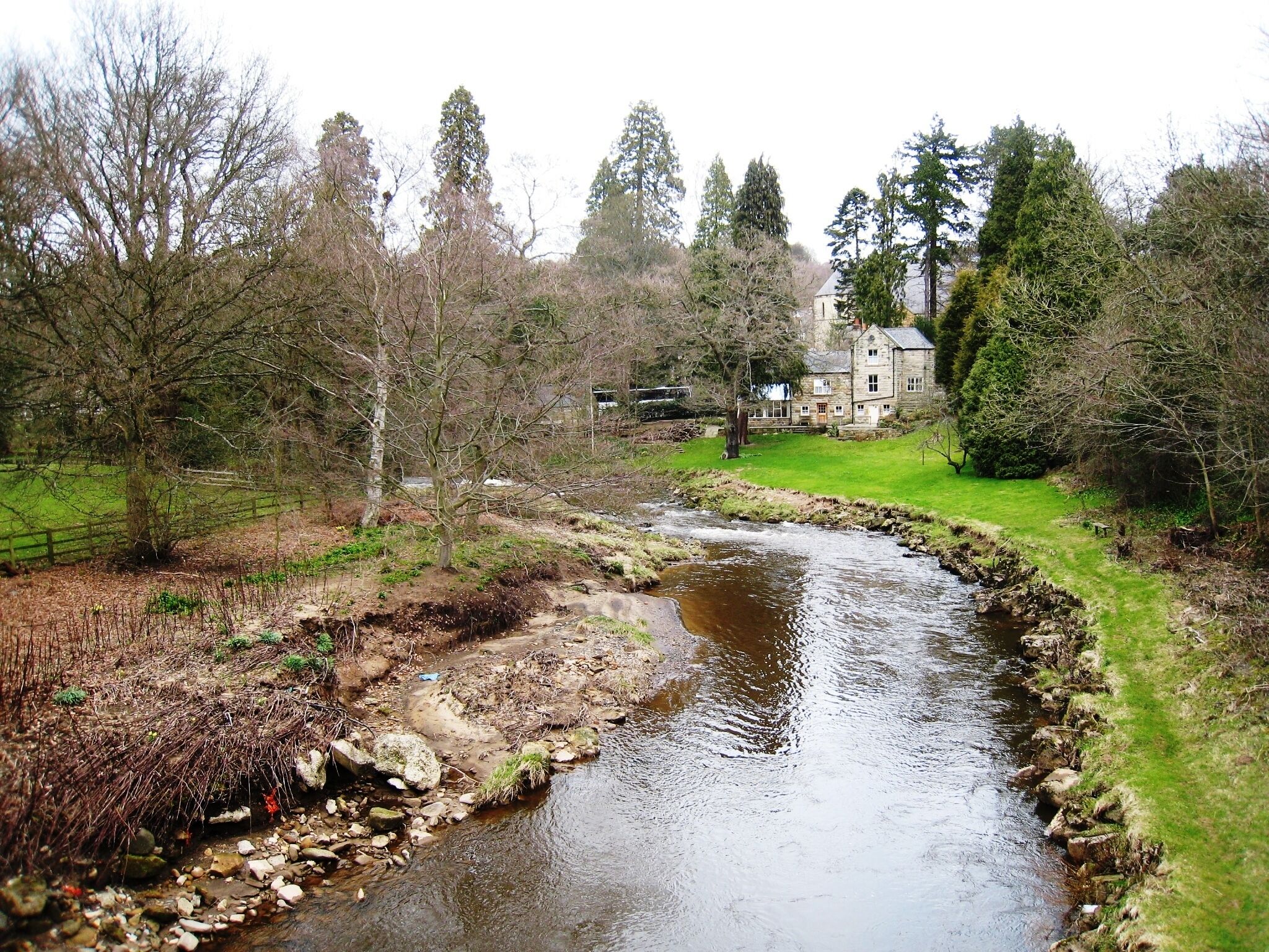 River Esk at Egton Bridge (March view). This photograph shows a view of the River Esk as it meanders from east to west through the Egton Bridge area. The picture was taken from the road bridge near Egton Manor looking in a northerly direction towards the railway station. An October view of the river can be seen here: 277285 .