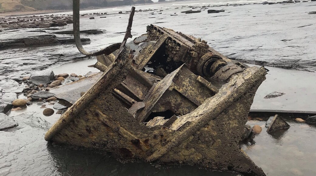What reminds of a boat looks like it’s been sucked in to sea floor#OnTheRoad #shipwreck#Whitby#