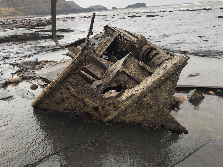 What reminds of a boat looks like it’s been sucked in to sea floor#OnTheRoad #shipwreck#Whitby#