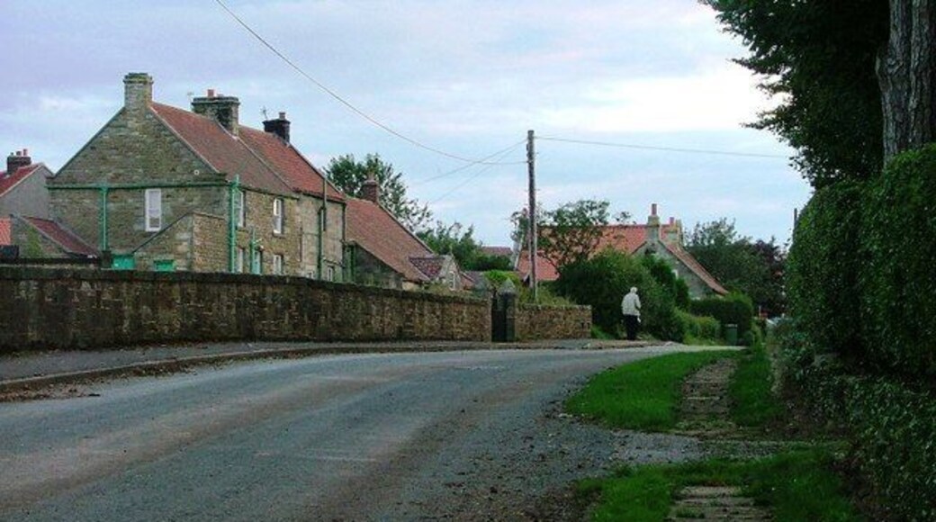 Ugthorpe. A late evening view looking west along the road towards the centre of the village taken from near Christ Church.