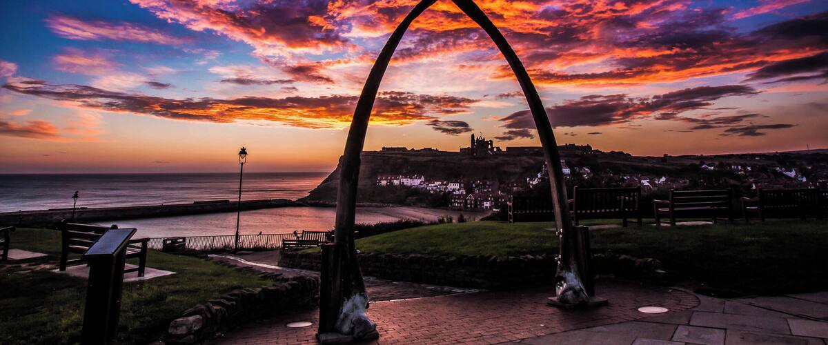 Early morning start to the day for a sunrise in Whitby North Yorkshire late winter but a great start to a day. A cold early morning in this location is the best to wait for the sunrise at it will rise just below the Abbey Cliff in the distance. The famous abbey which is standing out on the other side of the river Esk. A number of seat in this area for a relaxing sit down but not many people about because of the cold. Best part of the day.