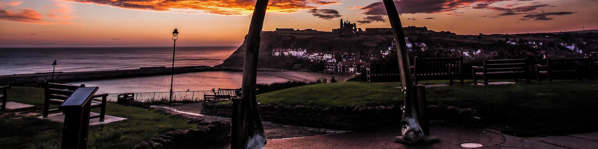 Early morning start to the day for a sunrise in Whitby North Yorkshire late winter but a great start to a day. A cold early morning in this location is the best to wait for the sunrise at it will rise just below the Abbey Cliff in the distance. The famous abbey which is standing out on the other side of the river Esk. A number of seat in this area for a relaxing sit down but not many people about because of the cold. Best part of the day.