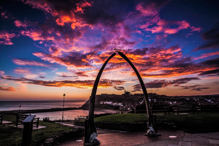 Early morning start to the day for a sunrise in Whitby North Yorkshire late winter but a great start to a day. A cold early morning in this location is the best to wait for the sunrise at it will rise just below the Abbey Cliff in the distance. The famous abbey which is standing out on the other side of the river Esk. A number of seat in this area for a relaxing sit down but not many people about because of the cold. Best part of the day.