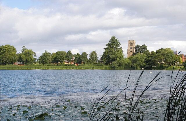 Hanmer Mere. Photograph taken looking towards the Parish Church of St. Chad in the village of Hanmer.
