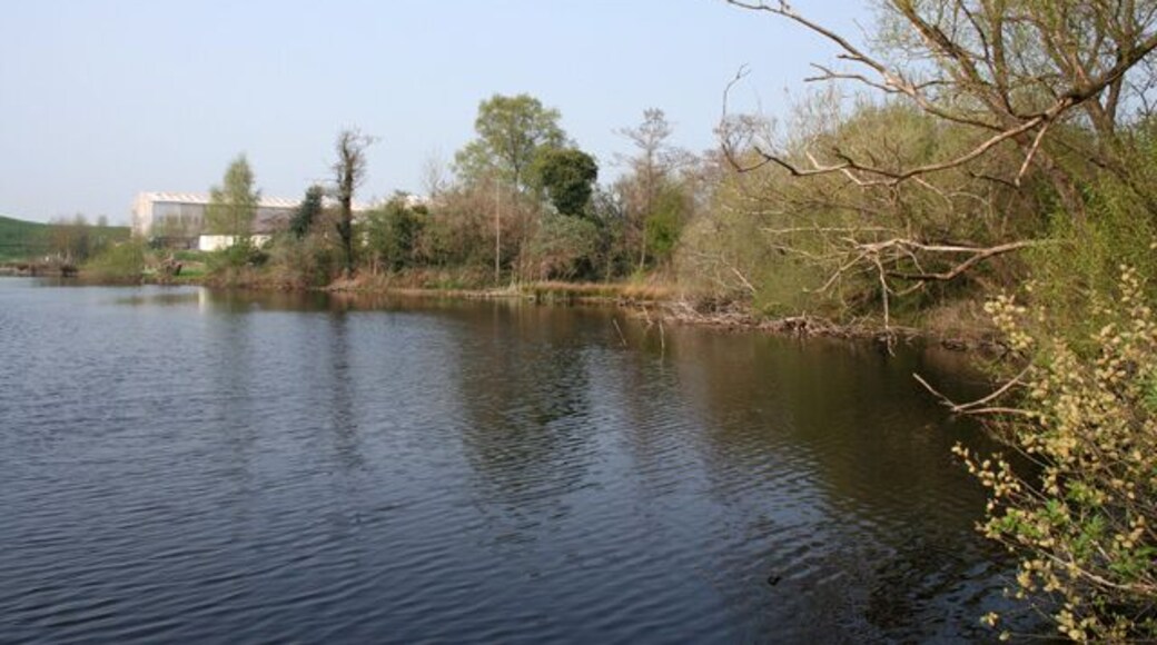 Mere at Fenn's Bank This large mere, one of two divided by a disused railway line, is adjacent to the Mereside industrial estate at Fenn's Bank; the factory buildings visible probably form part of the H. H. Wardle (Metals) Ltd aluminium works. Despite the adjacent factories, the mere is home to many wildfowl. View from a small promontory off the wooded east bank