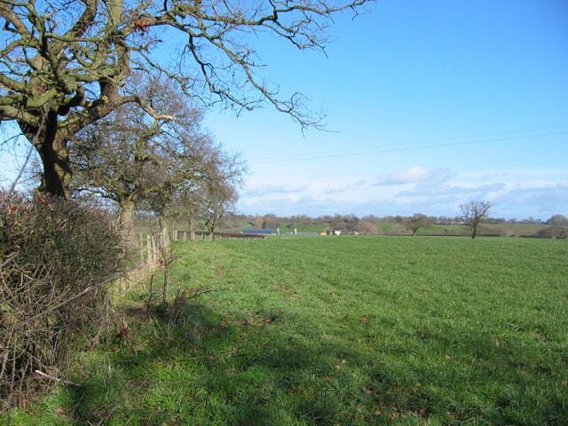 Pasture near Gipsy Corner Winter sun on rolling pasture. View east from the lane between Higher Wych and Iscoyd Park. The footpath to Bryn Owen runs on the far side of the field boundary. The farm in the valley is Wolvesacre Hall