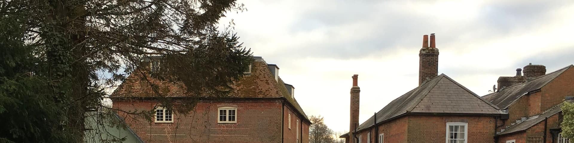Photo of the back of the Mill taken from the garden just a little up river