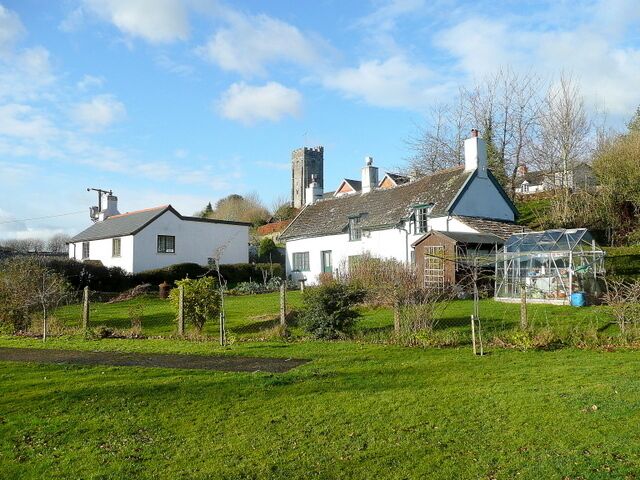 Cottages at Winsford Viewed from the picnic area in the centre of this Exmoor village. The church tower of St. Mary Magdalene rises up beyond.