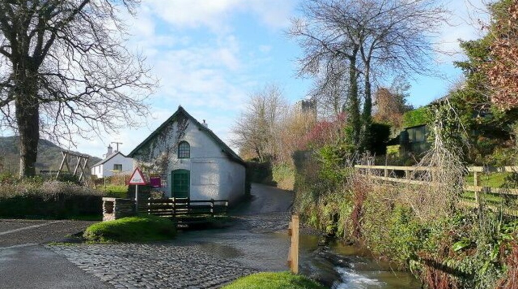 Winsford, Somerset A pretty village on the south side of the Exmoor Hills. The road to Withypool fords the Winn Brook with the church tower of St. Mary Magdalene beyond.