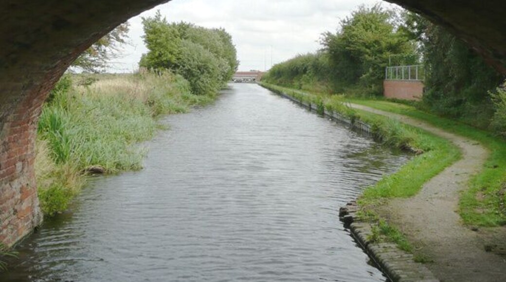 Birmingham and Fazeley Canal north of Curdworth, Warwickshire Seen from beneath the arch of Baylis's Bridge, and looking towards Curdworth Top Lock and the M6 (Toll) bridge.