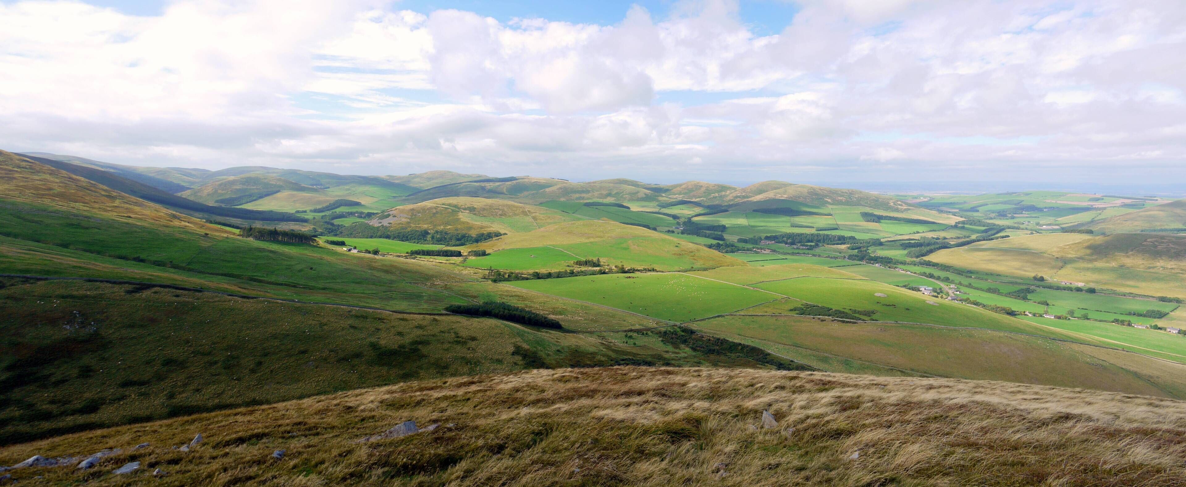 Panorama from west end of Yeavering Bell From Kirknewton (below, right) round to Hethpool and College Valley (left)