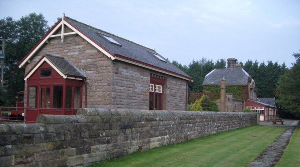 Former Railway Freight Warehouse at Akeld Station Freight and agricultural traffic continued along this part of the railway from Cornhill (Coldstream) until 1965. Grain and fertiliser were stored in the warehouse until collected by farmers, and heavy goods were loaded on and off the trains by a one ton crane located by the entrance to the warehouse, now converted. The former edge of the station platform is visible in this view.