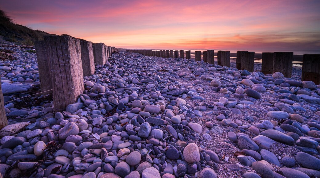 Groynes on Murlough Beach at sunrise. Newcastle, Northern Ireland.