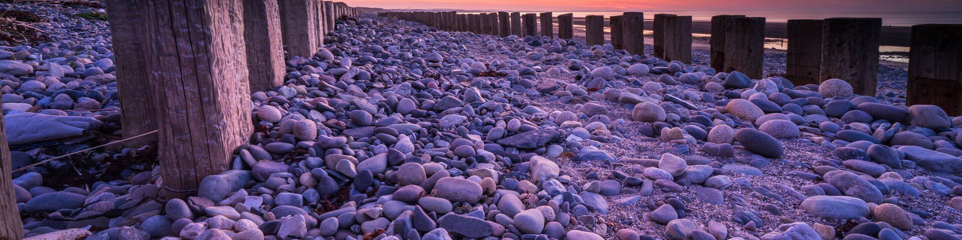 Groynes on Murlough Beach at sunrise. Newcastle, Northern Ireland.