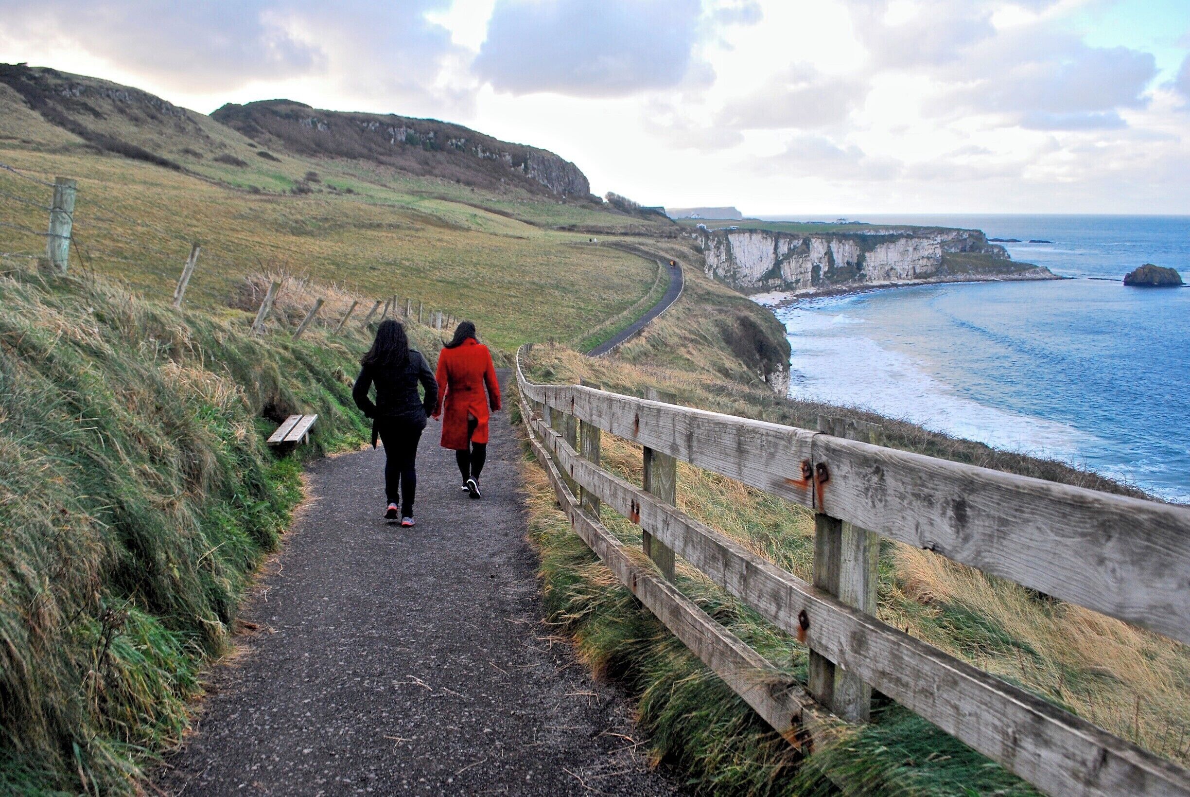 A coastal path with cliffs and the ocean.