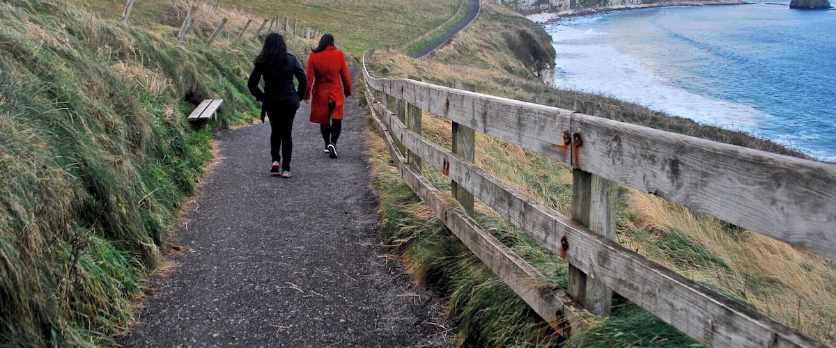 A coastal path with cliffs and the ocean.