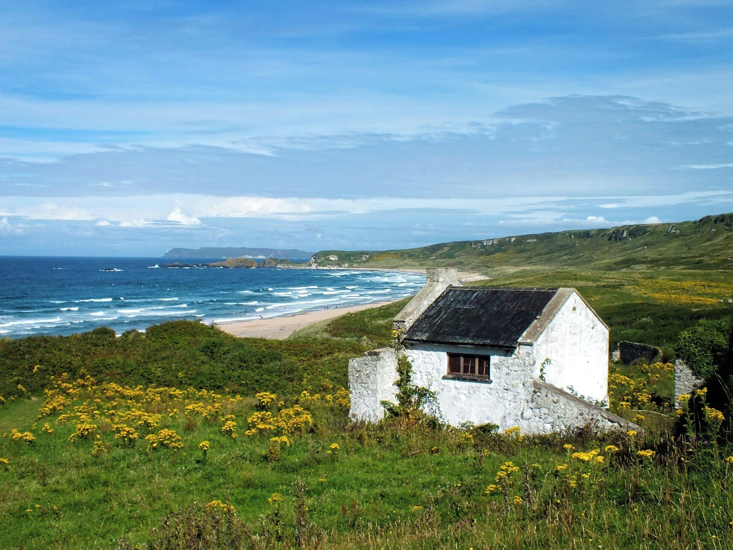 The spectacular sandy beach forms a white arc between two headlands on the North Antrim Coast. Its secluded location means that even on a busy day there is plenty of room for quiet relaxation.
The beach is also backed by ancient sand dunes that provide a range of rich habitats for bird and animal life. #beach
