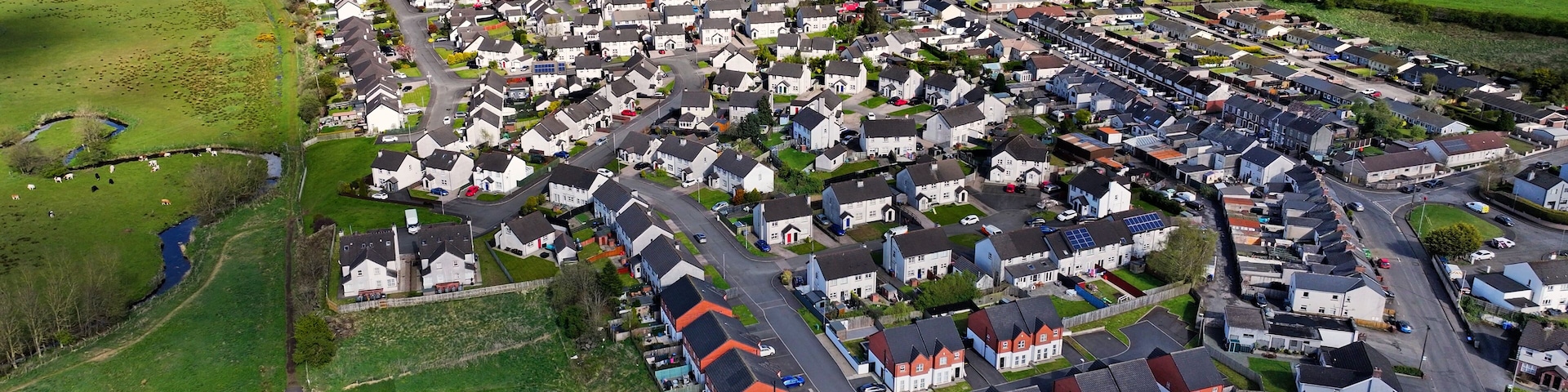 Aerial drone view of Residential housing homes Ballyclare Town in Antrim Northern Ireland UK