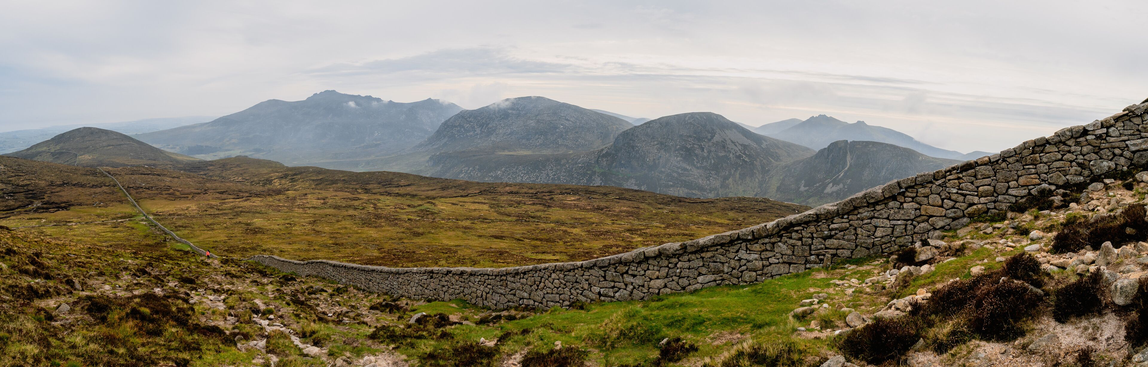 Panoramic view of typical Irish landscape, fields, sea in background. Picture taken from the top of Mourne mountains