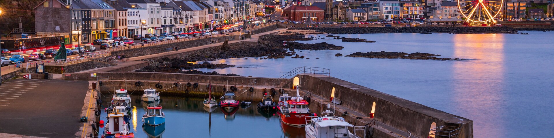 Portstewart showing night scenes, landscape views and a coastal town