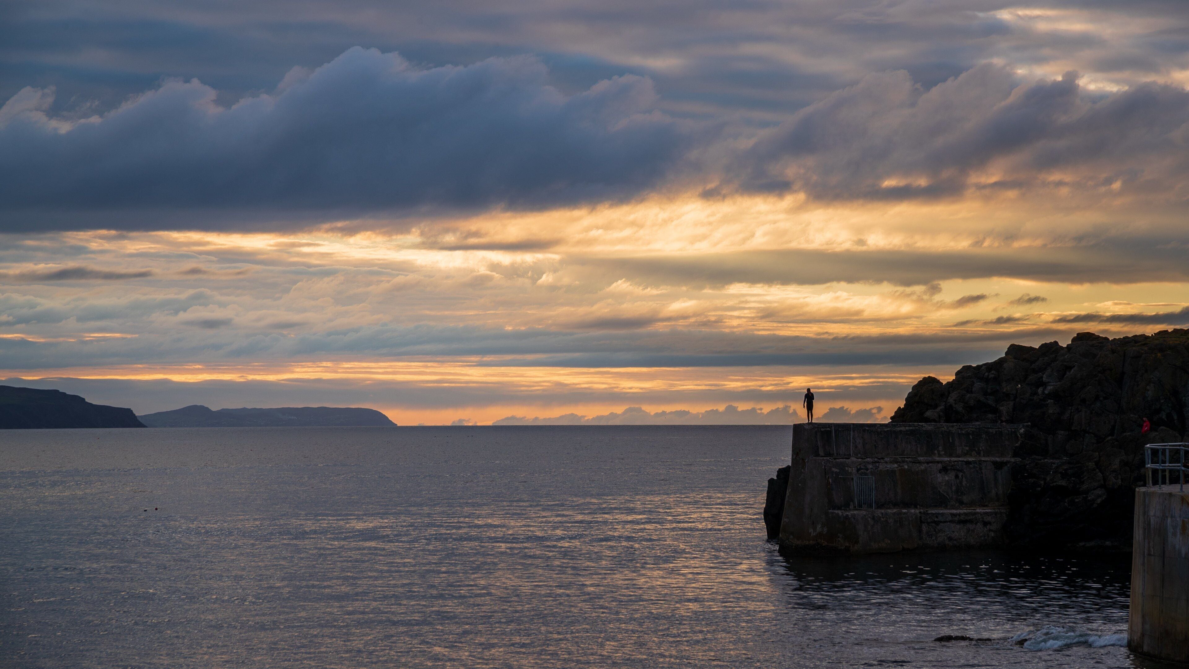 Portstewart showing general coastal views and a sunset