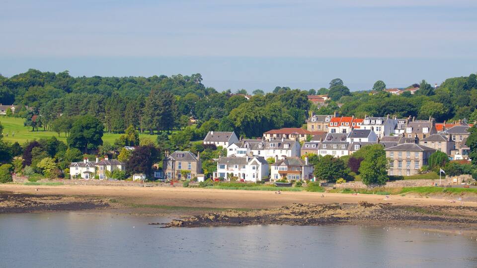 Aberdour featuring a coastal town, a beach and rugged coastline