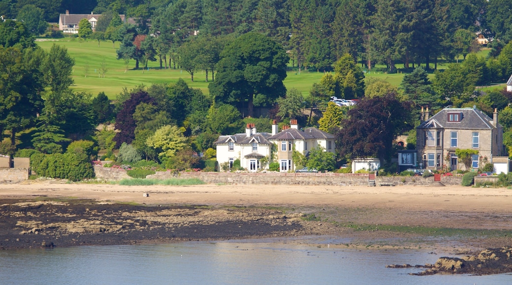 Aberdour showing a coastal town, a beach and rugged coastline