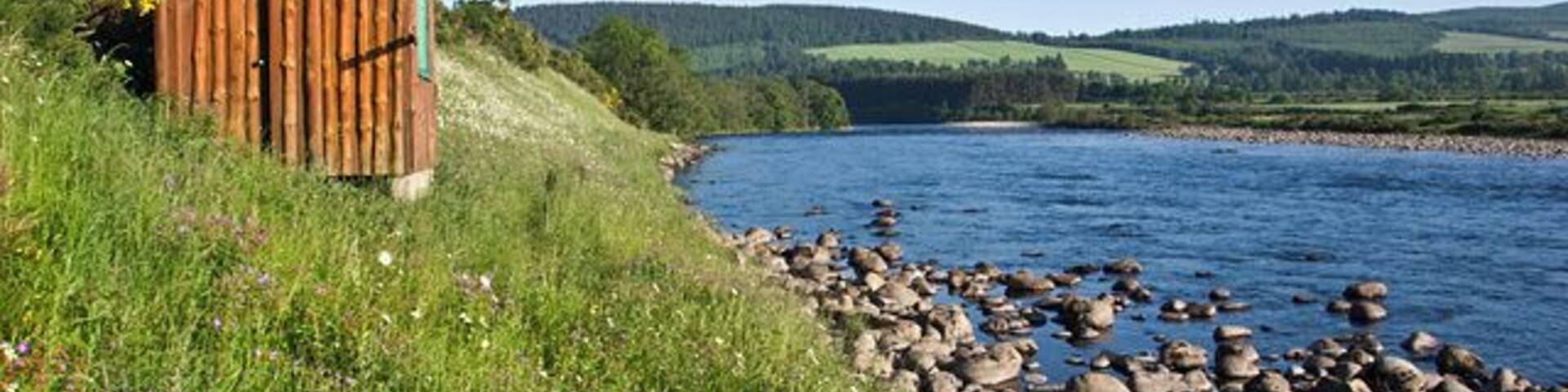 Fishing hut on the bank of the River Dee A small hut for use by those fishing on the river.