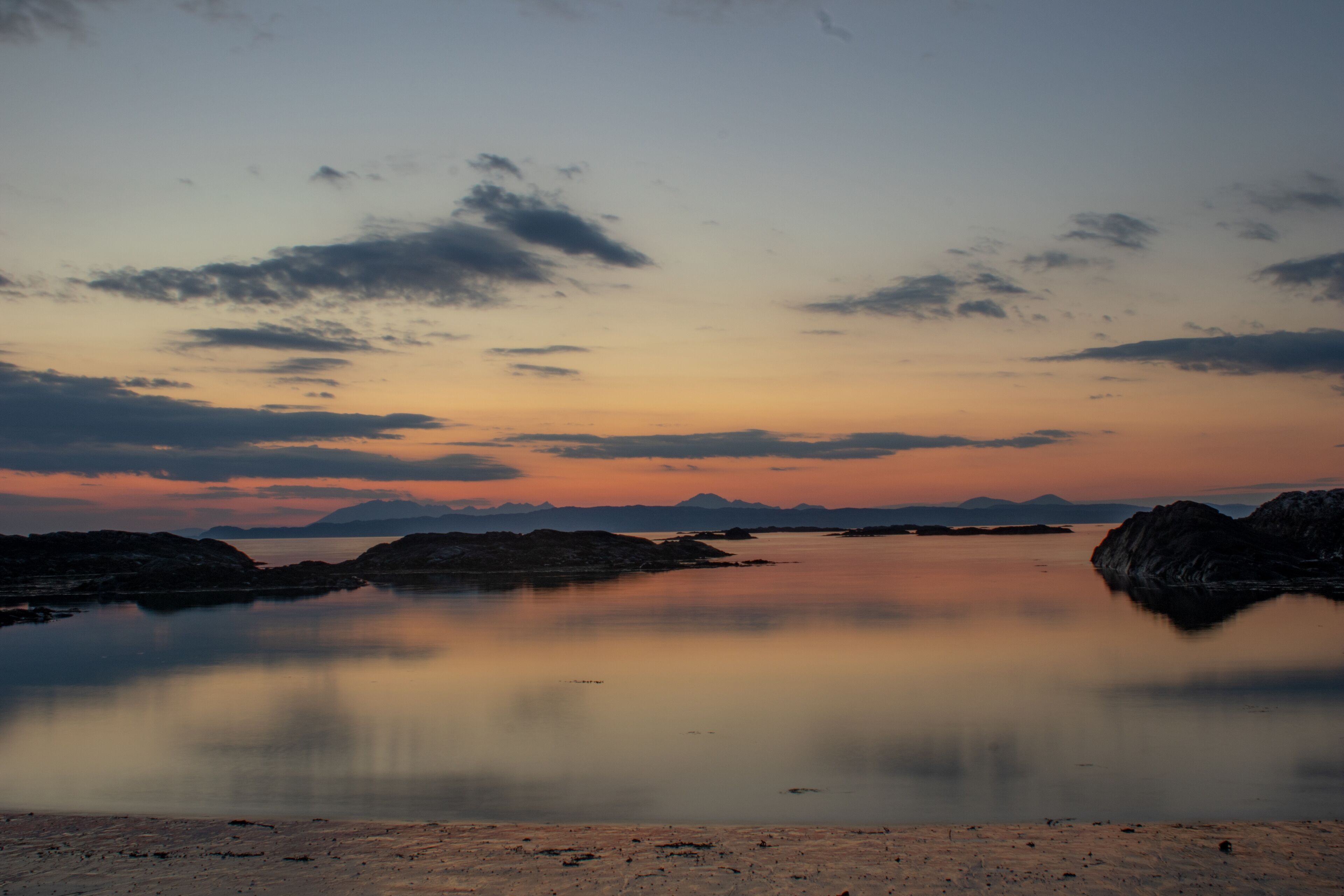 Sunsetting behind the distant Cullins (Isle of Skye) from Silversands