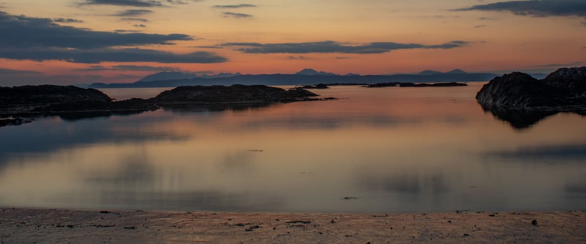 Sunsetting behind the distant Cullins (Isle of Skye) from Silversands