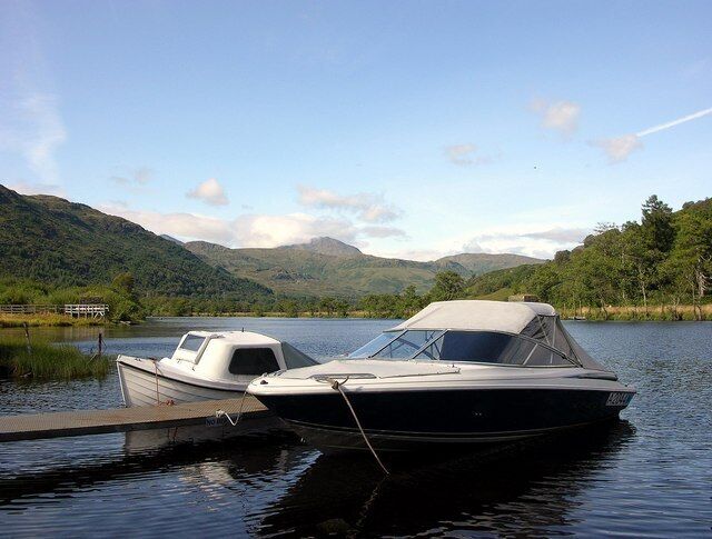 Boats on mooring, Ardlui Marina & Caravan Park. This stretch of water at the northern end of Loch Lomond provides a shelter for otters that can be commonly seen crossing between banks......