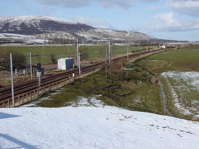 Site of Lamington rail station Looking along the main west-coast rail-line as it heads north past the site of the former Lamington station on a wintry day. The station itself closed and disappeared in the late 1960s.