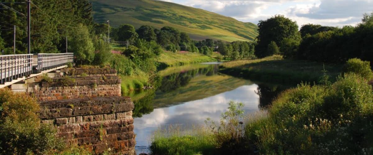 The viaduct on the West Coast Main Line across the River Clyde in July 2014. This viaduct was seriously damaged by flooding in 2016, and was rebuilt.