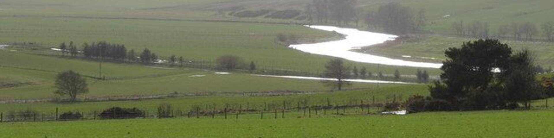 Wintry view towards the Clyde from Libberton school A cold day with a sharp biting wind and some snow on the hills near Tinto. The light was shining off the freezing water in the Clyde quite intensely.