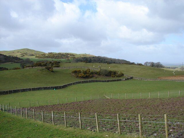 Boreland of Kelton Homestead Moat Archaeological site of the remains of a moated homestead site, possibly connected with the Cistercian monks at Dundrennan. The moat runs east in a semi-circle from the green feed bucket by the stone dyke.