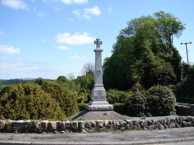 Auchencairn War Memorial. Well kept war memorial built 1920 in Aberdeen granite, crowned with a A.V.C. finial. Behind is the Millennium Garden, see 802827.