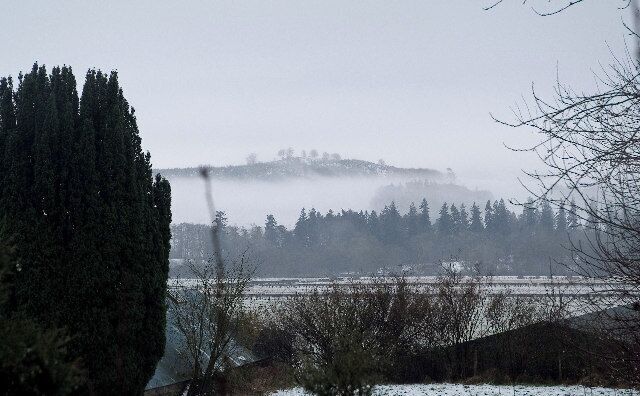 View across the Holm of Dalry. Mist in the hills to the south west of St. John's Town of Dalry.