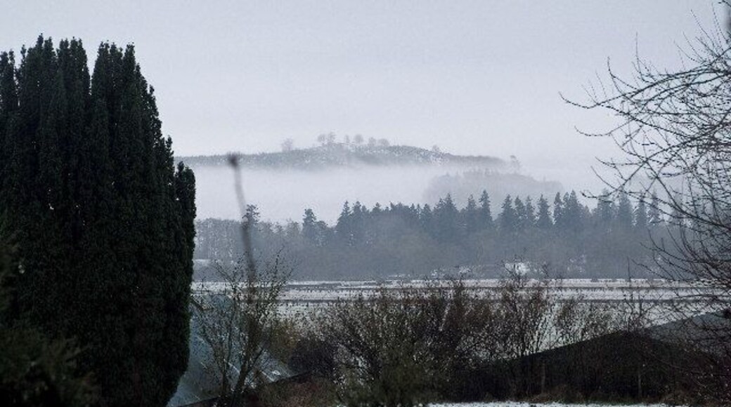 View across the Holm of Dalry. Mist in the hills to the south west of St. John's Town of Dalry.