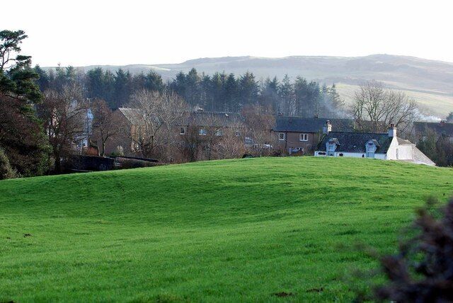Field near Springholm The burn runs through this field to the left of this picture. You can just make out the small bridge on the left.